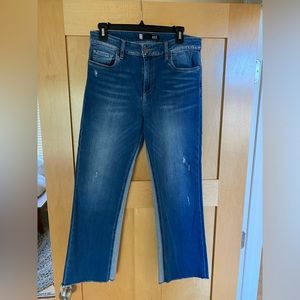 By KUT high-rise, Kelsey ankle flare with a small amount of destruction.